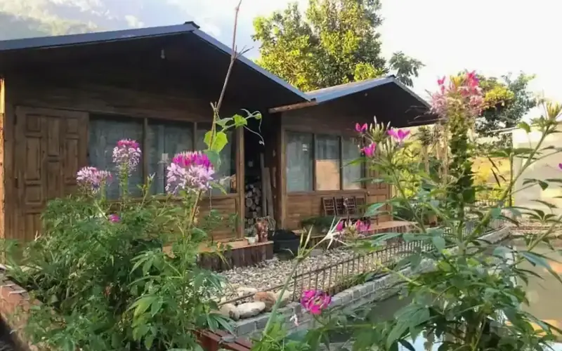 Sapa local family welcoming travelers into their hill tribe home for an authentic homestay